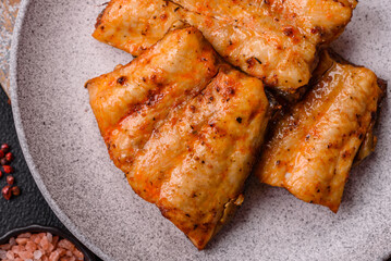 Grilled fish fillet with salt, spices and herbs