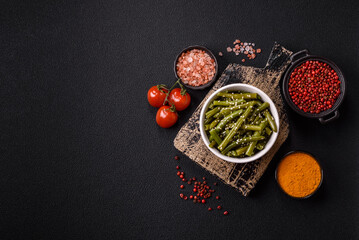 Steamed green beans on a plate with olive oil, sesame seeds