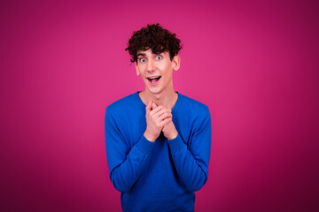 Funny happy student posing in studio.