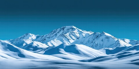 Fototapeta premium Majestic Snow-Covered Mountains Under Clear Blue Sky Landscape