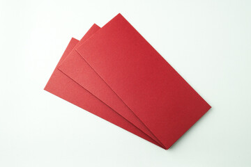 Stack of red envelopes gift isolated on white background. Concept for Chinese New Year. Empty blank...