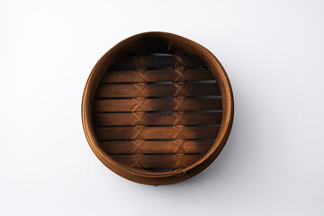 Close-up photo of Burnt wooden dimsum steamer container isolated on white background. Shot on 30 Degree, flat lay angle setup