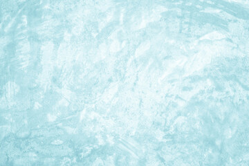 Grungy blue textured paper background with faded watercolor paint stains.