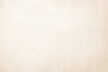 Closeup detail of beige fabric texture background. High resolution photo.