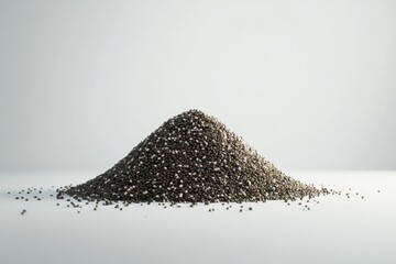 A mound of chia seeds, showcasing their unique texture and colors against a minimalist background.
