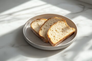 Freshly sliced loaf of bread on a minimalist plate, basking in natural sunlight.