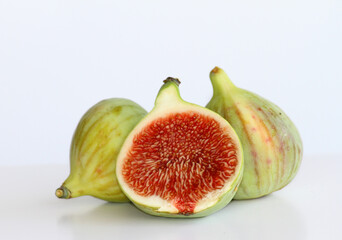 Delicious Two and Half ripe fresh figs isolated on white