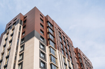Fototapeta premium low-angle view of a multi-storey apartment building. New residential complex in the city