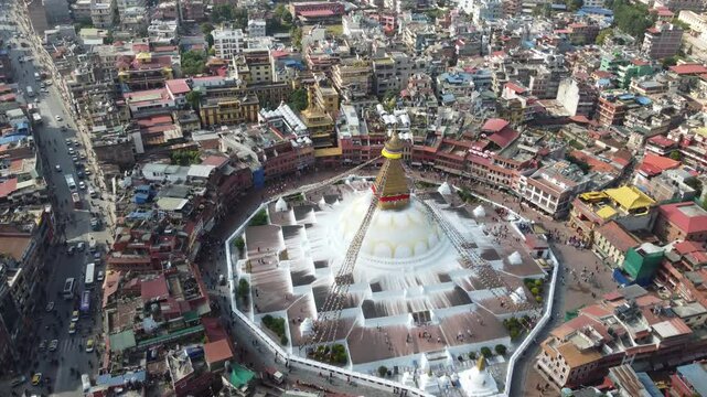 Aerial view of Boudhanath Stupa, a UNESCO World Heritage Site in Kathmandu, Nepal. This iconic Buddhist temple is renowned for its massive white dome and peaceful ambiance, making it a spiritual hub.