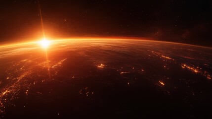 Obraz premium A breathtaking view of Earth from space, showcasing a stunning sunrise illuminating the horizon.
