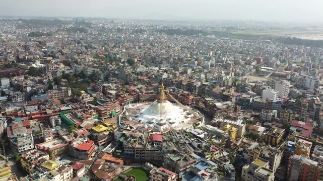 Aerial view of Boudhanath Stupa, a UNESCO World Heritage Site in Kathmandu, Nepal. This iconic Buddhist temple is renowned for its massive white dome and peaceful ambiance, making it a spiritual hub.