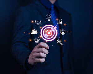 Business goal setting concept. Businessman holding virtual target icon for business purpose. Strategic planning for business growth. Marketing strategy and goal for success.