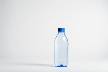 Naklejka premium there is a bottle of water sitting on a white surface