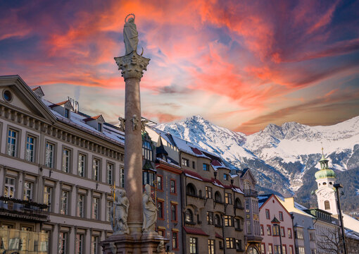 view of the karwendel mountains with the old town innsbruck in austria tyrol winter snow landscape at sunset