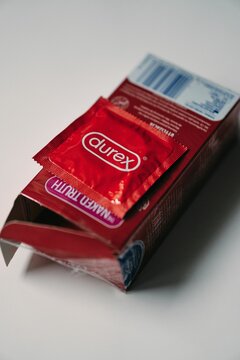 Vertical shot of red Durex brand condoms in a box