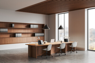 Modern coworking office with wooden furniture and large windows in minimalist interior design...