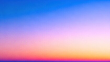 Obraz premium Vibrant sunset colors paint the sky with a beautiful gradient of blues, pinks, and oranges. A serene and peaceful scene perfect for backgrounds and designs.