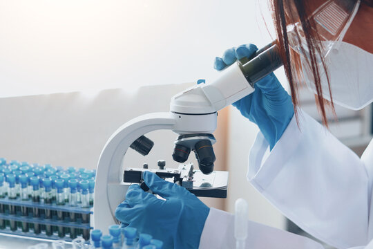 Asian female scientist researching biochemistry - Powered by Adobe