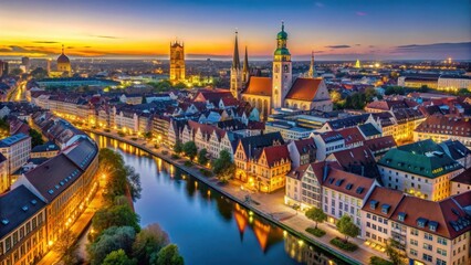 Fototapeta premium Aerial view of illuminated M?nchen Innenstadt at dusk