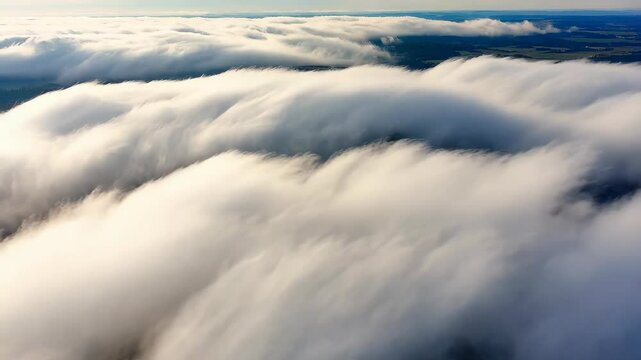 Serene cloud layers unfurling over tranquil landscape at dawn