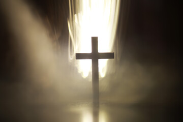 Dramatic Christian Cross in Misty Light with Spiritual Aura and Mystical Atmosphere
