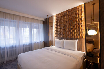 interior of a modern hotel bedroom in the morning