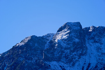 Fototapeta premium Alpine landscape in the Swiss Alps at Albula Valley on a sunny autumn day seen from Swiss mountain village of Brienz Brinzauls. Photo taken November 15th, 2024, Brienz Brinzauls, Switzerland.