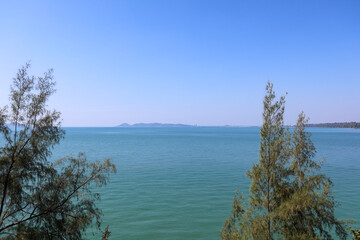 Nice landscape sea with trees and mountains as elements background. Travel Rayong Province, Thailand.