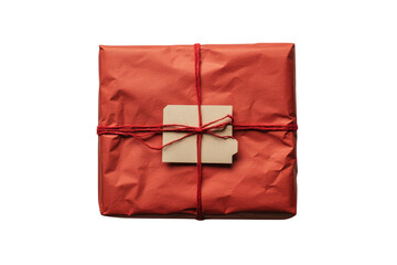 Wrapped gift in vibrant red paper with a rustic tag ready for celebration