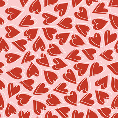 Romantic seamless pattern with red hearts and their white outlines on pink background
