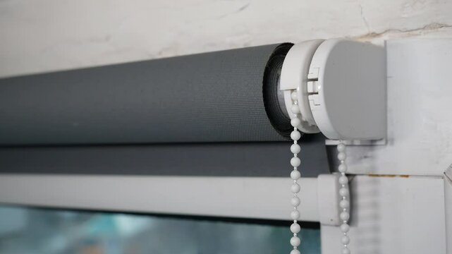 Roller blind system opens window.