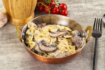 Italian cuisine - farfalle with mushrooms