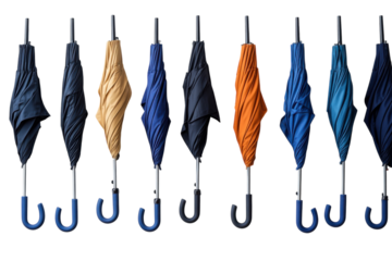 Colorful collection of umbrellas hanging in a row against a white backdrop in a retail display setting
