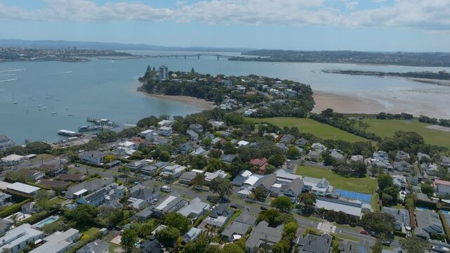 High-angle view of Auckland, New Zealand. Residential and commercial areas meet the harbor. Beautiful city scape. Devonport, Auckland, New Zealand