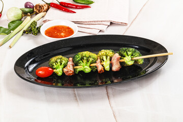 Thai Street foof satay with bacon and broccoli