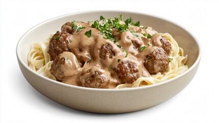 Meatball stroganoff in a shallow bowl, with delicate streaks of sauce artfully drizzled, isolated on a modern white background