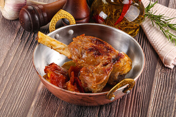 Baked lamb shank with vegetables