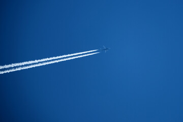 airplane in the blue sky, closeup of photo with soft focus