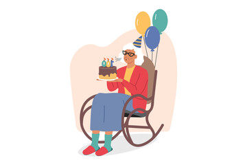 Elderly woman celebrates centenary and blows out candles on birthday cake, sits in rocking chair with balloons. Centenary for residents of nursing home or hospice for people without relatives