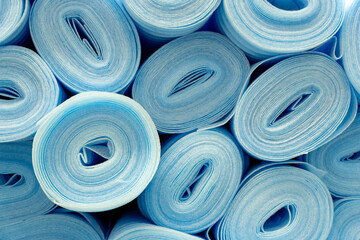 Large rolls of green PVC polymer underlay for parquet and laminate flooring