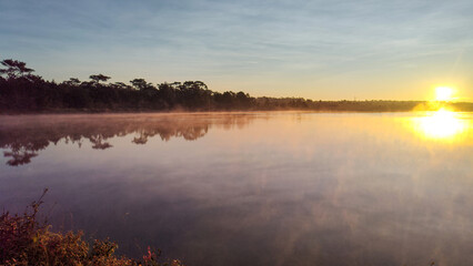 Fototapeta premium Fog is spreading over a lake in a morning