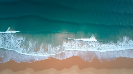 Aerial View of Ocean Waves Crashing on Sandy Shore