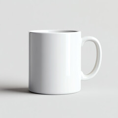 A simple white ceramic mug on a soft gray background, perfect for coffee, tea, or hot beverages.