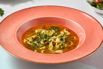 Vibrant Chicken Noodle Soup in Rustic Pink Bowl