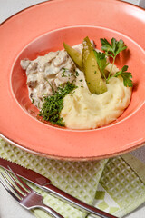 Exquisite Beef Stroganoff with Creamy Mashed Potatoes on a Vibrant Plate