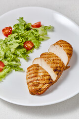 Grilled Chicken Fillet with Fresh Garden Salad on White Plate – Vibrant Culinary Photography with Soft Lighting