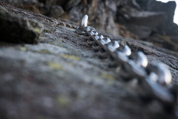 Belaying, chains in difficult places on a high mountain trail in the High Tatras.

