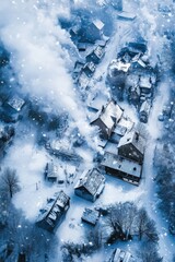 Aerial view of snowfall over a rural village, smoke rising from chimneys