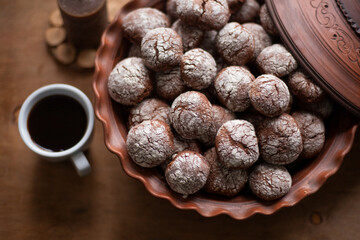 Marble cookies. Chocolate and powdered sugar. Cup of coffee. Sweet food