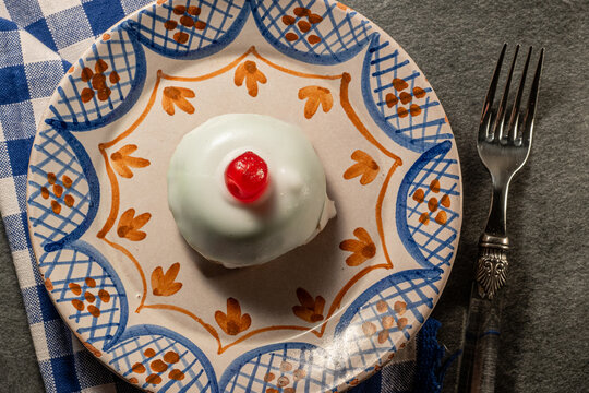 Traditional Sicilian cassata, sweet dessert cake with ricotta and candied fruits on ancient ceramic plate